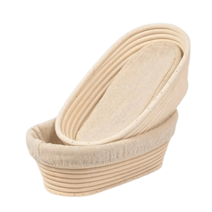 Natural rattan wooden dough bowl for baking and serving bread.