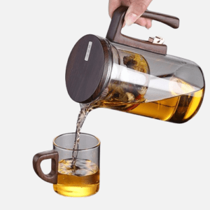 Heat-resistant glass teapot with magnetic infuser and wooden handle, perfect for brewing loose-leaf tea.